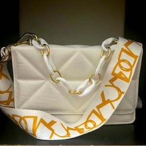 this purse is from shein it’s a gold/white purse, square shaped, only use once.